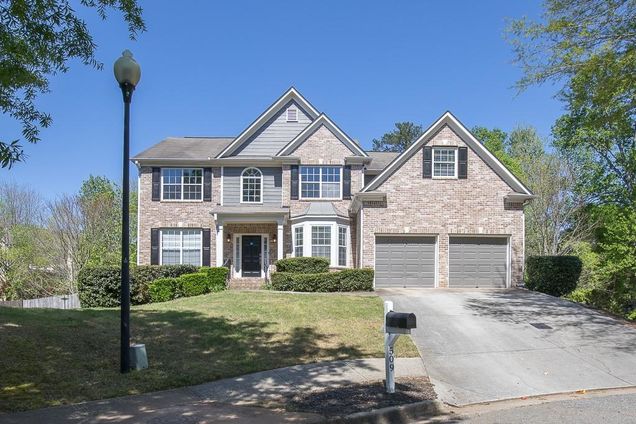 Exterior of a modern single-family home in Serenade, Woodstock GA community with Craftsman-style design.