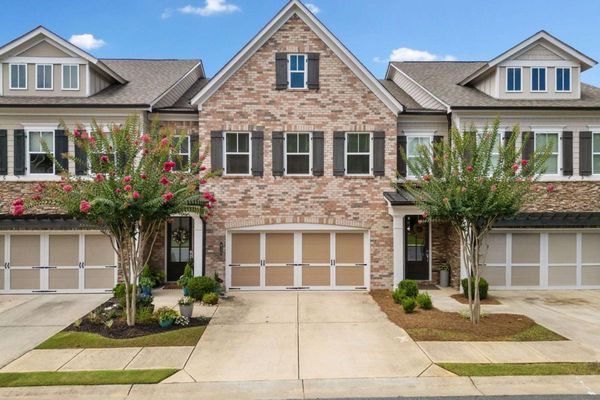 Craftsman-style townhome in Bellehaven Woodstock GA with attached garage and landscaped exterior