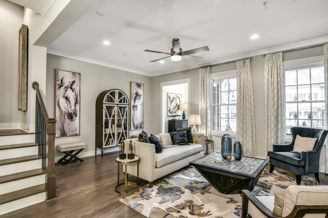 Open-concept living room in a South on Main townhome with hardwood floors and natural light