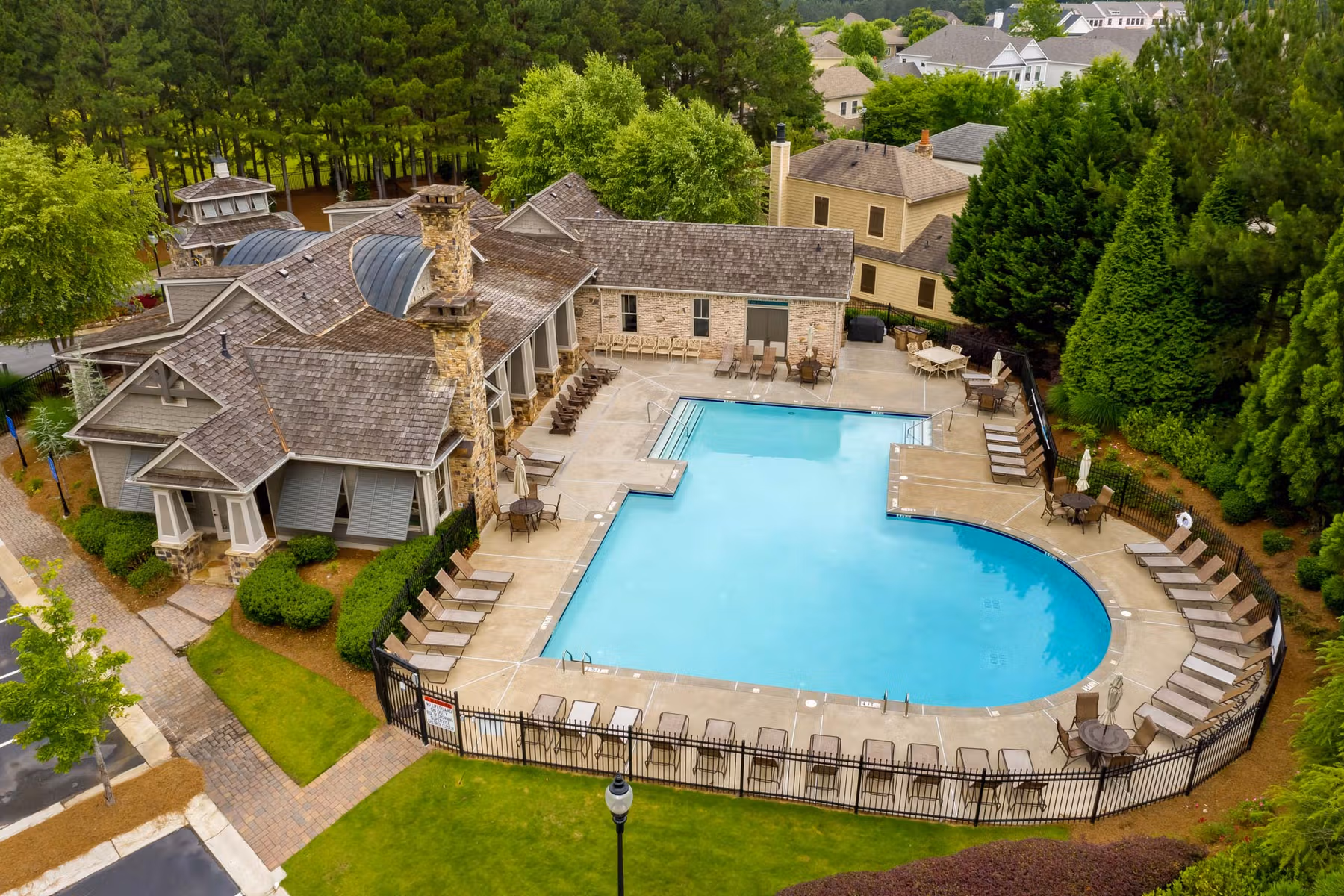 Luxury gated homes at The Village at Towne Lake in Woodstock, GA with resort-style amenities and landscaped courtyards.